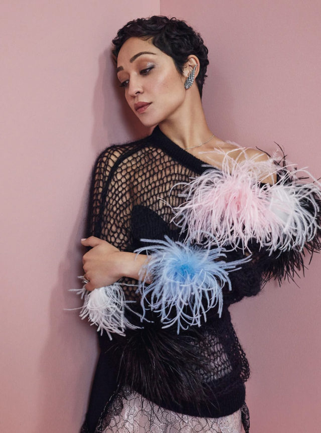 Ruth Negga for Harper's Bazaar December 2017 black sweather with ostrich feathers