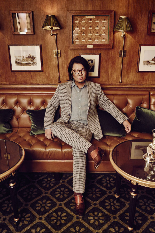 Crazy rich couture in US Harper’s Bazaar September 2018 - Crazy rich couture Kevin Kwan on couch