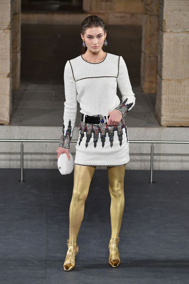 Chanel Metiers d'Art 2018 show - white mini dress with gold leggings