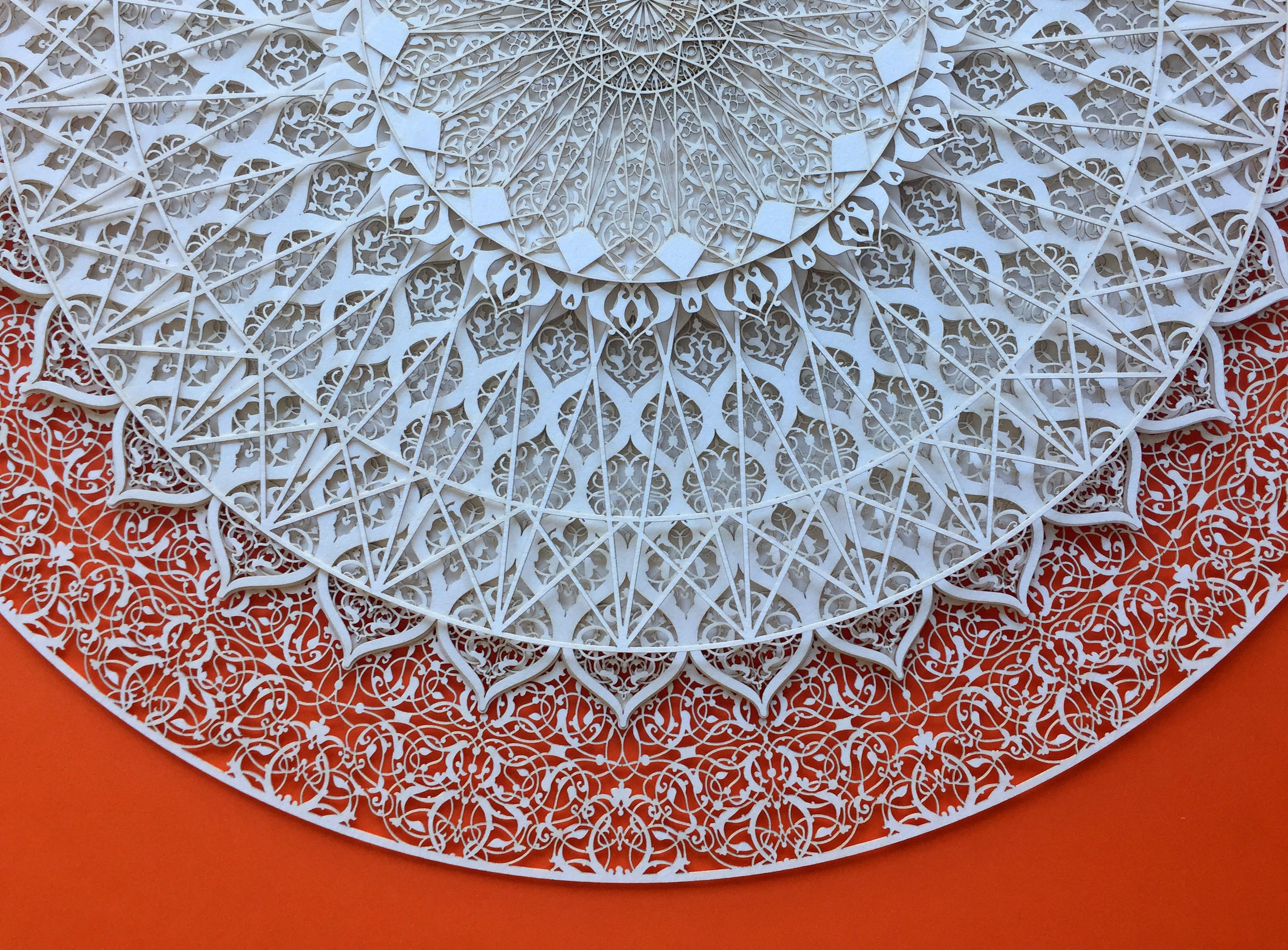 Julia Ibbini laser cut art - white circle against orange