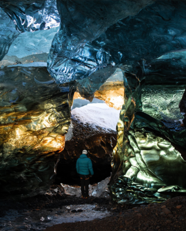 Winter in an Icelandic cave - against gold and green entrane
