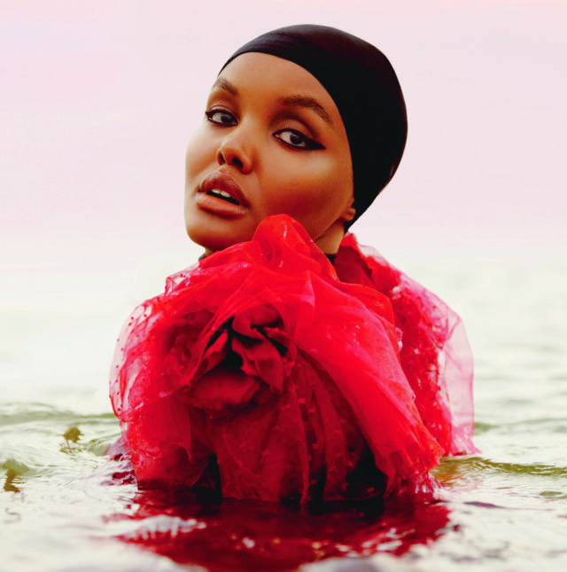 Halima Aden for UK Elle November 2018 - black cap and red top